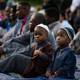 Young boys wait for the beginning of a prayer during an Eid al-Fitr celebration, which marks the end of Ramadan, on June 25, 2017, in Pittsburgh